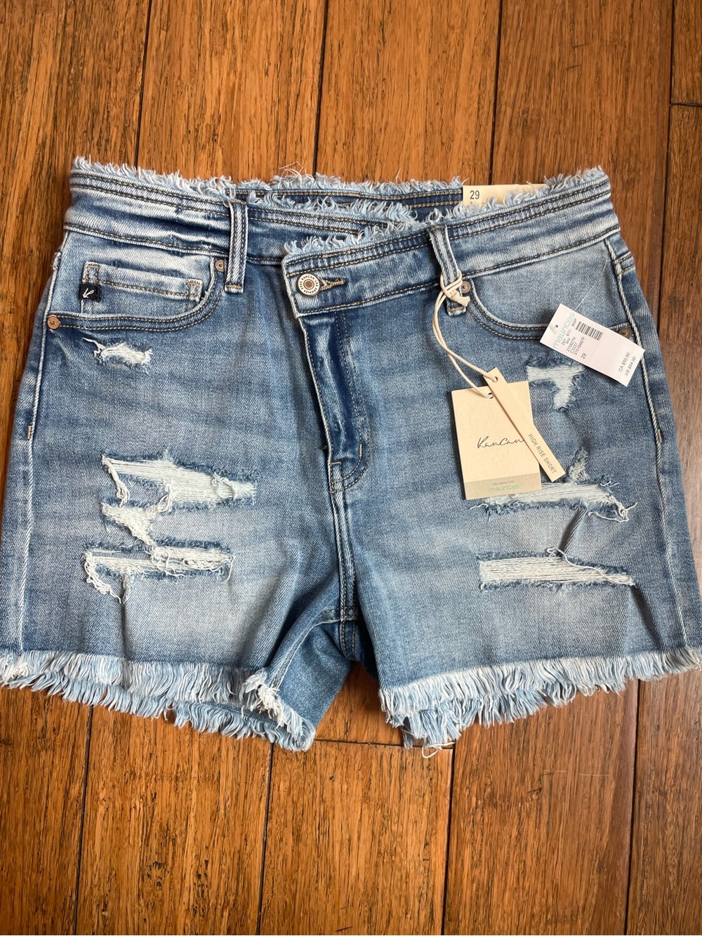 KanCan High Rise Crossover Ripped 3.5in short with frayed distressed hem